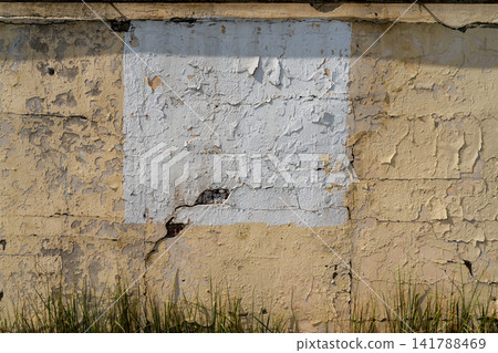 Peeling Paint On Aged Beige Plaster Wall With Cracked Texture And Weathered Surface Peeling Paint On Aged Beige Plaster Wall With Cracked Texture And Weathered Surface 141788469
