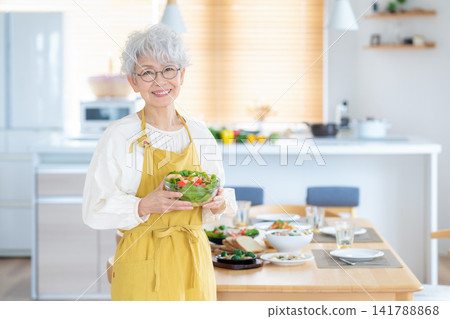 Senior women cooking at home Senior women cooking at home 141788868
