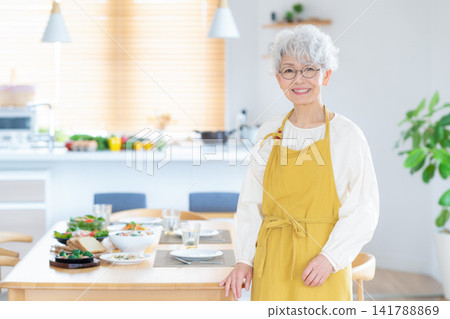Senior women cooking at home Senior women cooking at home 141788869