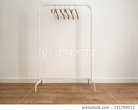 White Metal Clothes Rack with Bamboo Hangers, Angled View White Metal Clothes Rack with Bamboo Hangers, Angled View 141789551