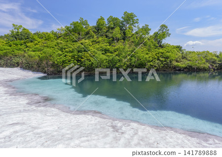 Hokkaido's Daisetsuzan: A breathtaking early summer scene of Shikibu Pond in the Daisetsuzan Plateau marshland and lingering snow. Hokkaido's Daisetsuzan: A breathtaking early summer scene of Shikibu Pond in the Daisetsuzan Plateau marshland and lingering snow. 141789888