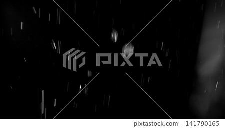 High speed close up of falling rain droplets isolated on a black background creating a realistic weather VFX overlay perfect for cinematic compositing visual effects motion graphics and atmospheric High speed close up of falling rain droplets isolated on a black background creating a realistic weather VFX overlay perfect for cinematic compositing visual effects motion graphics and atmospheric 141790165