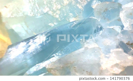 Blue aquamarine crystal cluster with translucent prisms, rough quartz matrix, sparkling facets, pale aqua tones, and natural mineral texture in soft light, with aquamarine, crystal, mineral Blue aquamarine crystal cluster with translucent prisms, rough quartz matrix, sparkling facets, pale aqua tones, and natural mineral texture in soft light, with aquamarine, crystal, mineral 141790376