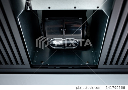 Extractor motor inside modern black cooker hood Extractor motor inside modern black cooker hood 141790666