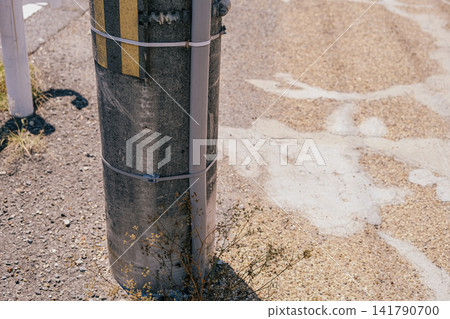 【#TelephonePole】A scene of a telephone pole illuminated by the summer sun and dry ground. 141790700