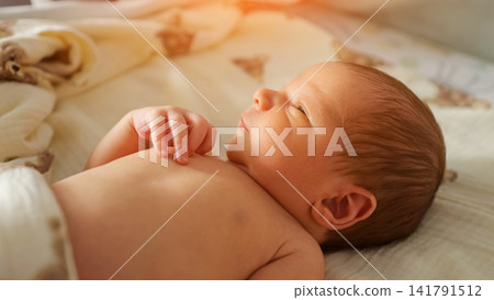 Newborn baby sleeping peacefully creating innocence and childhood concept Newborn baby sleeping peacefully creating innocence and childhood concept 141791512