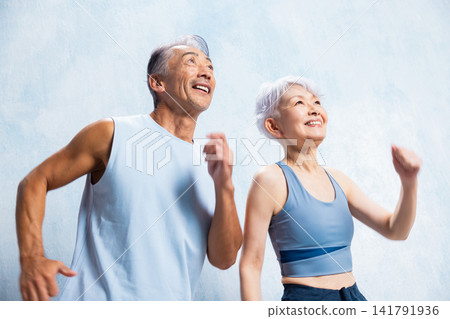 A lively senior couple doing stretches A lively senior couple doing stretches 141791936