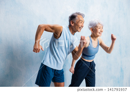 A lively senior couple doing stretches A lively senior couple doing stretches 141791937