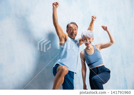 A lively senior couple doing stretches A lively senior couple doing stretches 141791960