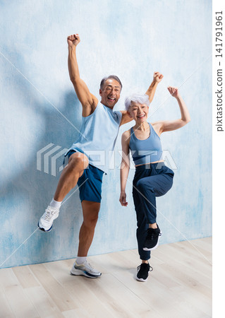 A lively senior couple doing stretches A lively senior couple doing stretches 141791961