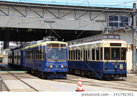 A blue Toden Arakawa Line streetcar parked at the Arakawa depot (Arakawa Ward, Tokyo) A blue Toden Arakawa Line streetcar parked at the Arakawa depot (Arakawa Ward, Tokyo) 141792301