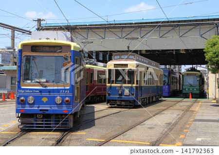 A blue Toden Arakawa Line streetcar parked at the Arakawa depot (Arakawa Ward, Tokyo) A blue Toden Arakawa Line streetcar parked at the Arakawa depot (Arakawa Ward, Tokyo) 141792363
