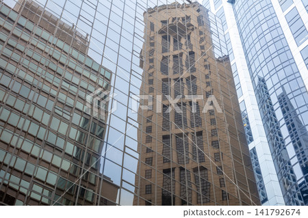 Glass Facades with Reflections of Skyscrapers Glass Facades with Reflections of Skyscrapers 141792674