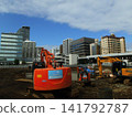 Red heavy machinery at a construction site 141792787