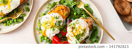 This meal features gluten free bread sandwiches topped with zucchini caviar and poached egg. It includes roasted red peppers and green peas, served with baked pears. banner This meal features gluten free bread sandwiches topped with zucchini caviar and poached egg. It includes roasted red peppers and green peas, served with baked pears. banner 141792821