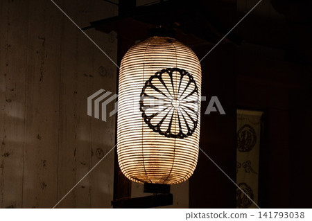 Lanterns with chrysanthemum crests lit at night Lanterns with chrysanthemum crests lit at night 141793038