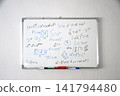 Whiteboard with handwritten mathematical formulas and geometric equations on a white wall	 141794480