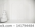 Elegant white three-tiered cake with black bows in minimalist arch interior	 141794484