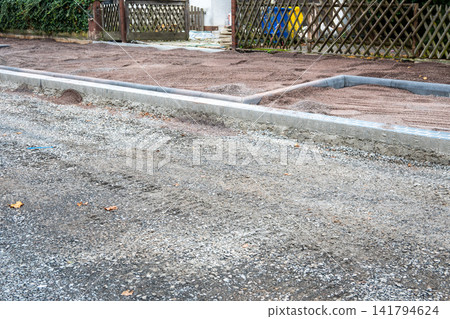 Pavement tiles for road sidewalk repair work on the street. Construction process and urban infrastructure in big city. Pavement tiles for road sidewalk repair work on the street. Construction process and urban infrastructure in big city. 141794624