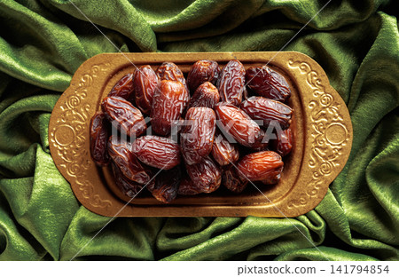 Dates on a golden platter. Dates on a golden platter. 141794854