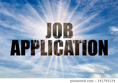 Job application conceptual phrase against a sunny blue daytime sky with sun rays Job application conceptual phrase against a sunny blue daytime sky with sun rays 141795234