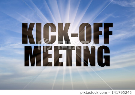 Kick-off meeting black text on a clear blue daytime sky with bright sun rays Kick-off meeting black text on a clear blue daytime sky with bright sun rays 141795245