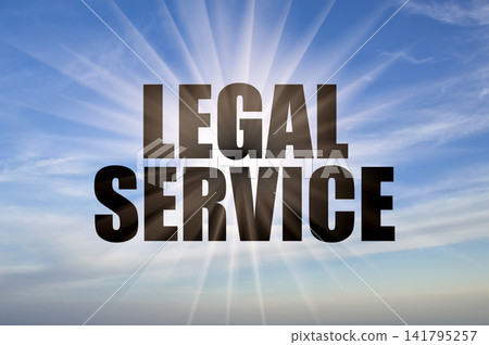 Legal service conceptual phrase against a clear blue daytime sky with bright sun rays Legal service conceptual phrase against a clear blue daytime sky with bright sun rays 141795257