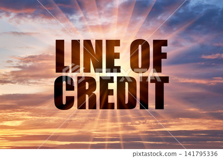 Line of credit conceptual text on a dramatic colorful evening sky with bright rays Line of credit conceptual text on a dramatic colorful evening sky with bright rays 141795336