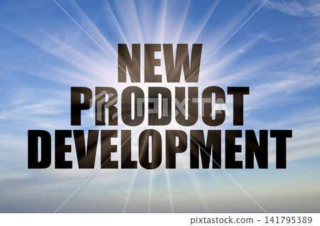 New product development words on a clear blue daytime sky with bright sun rays New product development words on a clear blue daytime sky with bright sun rays 141795389