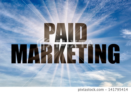 Paid marketing concept glowing on blue sky Paid marketing concept glowing on blue sky 141795414