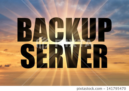 Backup server conceptual text on a cloudy golden evening sky 141795470