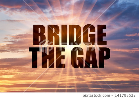 Bridge the gap phrase on a bright golden evening sky with sun rays Bridge the gap phrase on a bright golden evening sky with sun rays 141795522