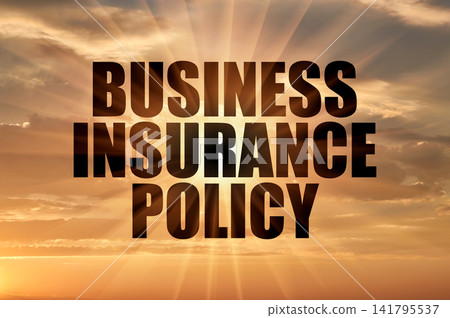 Business insurance policy phrase on a golden sunset sky with sun rays Business insurance policy phrase on a golden sunset sky with sun rays 141795537