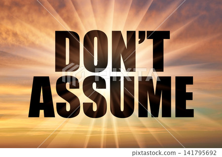 Don't assume text against glowing sun rays in sunset sky Don't assume text against glowing sun rays in sunset sky 141795692