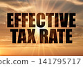 Effective tax rate text against golden sun rays in evening sky 141795717