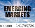 Emerging markets text against bright sun rays in blue sky 141795720