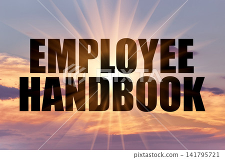 Employee handbook text against golden sun rays in evening sky Employee handbook text against golden sun rays in evening sky 141795721