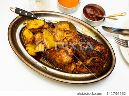 Half of roasted chicken with two sauces Half of roasted chicken with two sauces 141796362