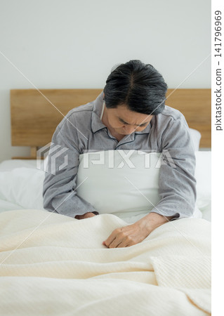 Senior man in the bedroom Senior man in the bedroom 141796969