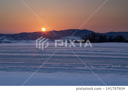 Okhotsk Sea drift ice and sunrise, Hokkaido winter scenery Okhotsk Sea drift ice and sunrise, Hokkaido winter scenery 141797604