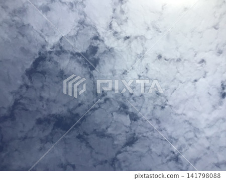 Ice-like clouds with sunlight shining through them Ice-like clouds with sunlight shining through them 141798088