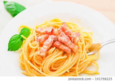Rich carbonara with thick-cut bacon and basil Rich carbonara with thick-cut bacon and basil 141798225