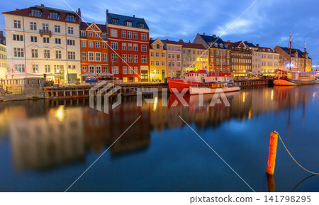 Nyhavn harbor panorama with colorful waterfront buildings at dawn in Copenhagen Denmark Nyhavn harbor panorama with colorful waterfront buildings at dawn in Copenhagen Denmark 141798295