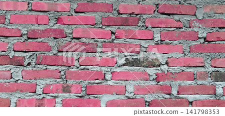 Texture of a light red brick wall with rough cement mortar. Texture of a light red brick wall with rough cement mortar. 141798353