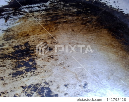 Distressed Metallic Surface with Dark Stains and Scratches Abstract Background Distressed Metallic Surface with Dark Stains and Scratches Abstract Background 141798428