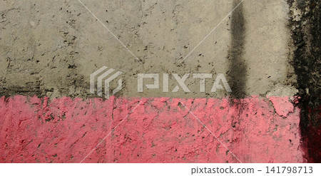 Weathered concrete wall with a pink painted band. Weathered concrete wall with a pink painted band. 141798713