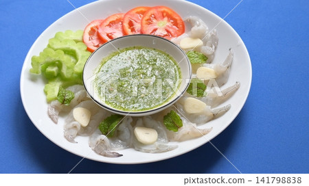 shrimp in fish sauce with Thai spicy seafood dipping sauce on white plate shrimp in fish sauce with Thai spicy seafood dipping sauce on white plate 141798838