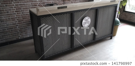 Industrial style coffee bar table with brick wall background Industrial style coffee bar table with brick wall background 141798997