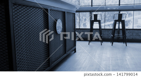 A stylish photo with blue tones featuring the interior of a modern industrial-style cafe. A stylish photo with blue tones featuring the interior of a modern industrial-style cafe. 141799014