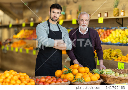 Two male sellers in vegetable shop 141799463